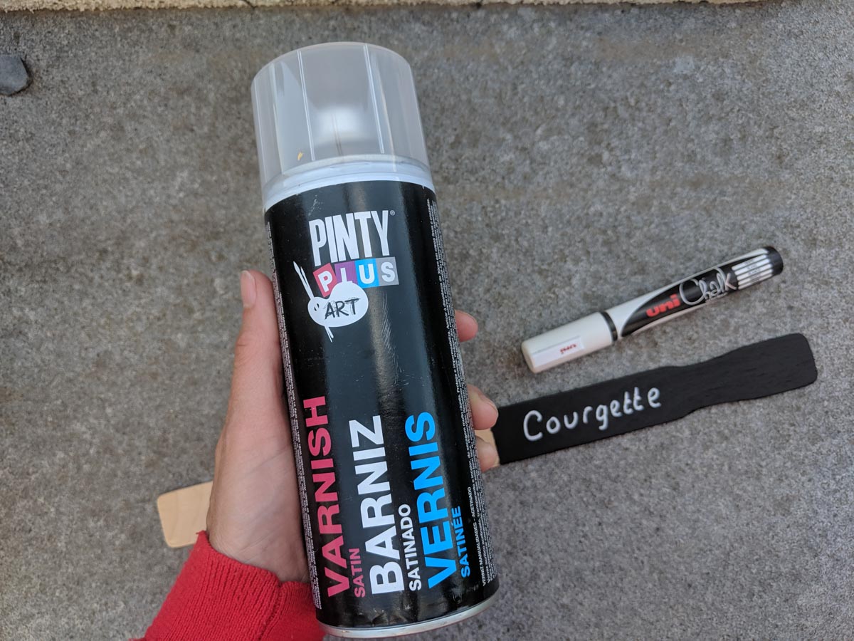 spray varnish to protect blackboard vegetable markers